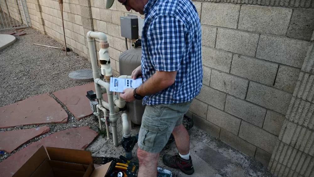 A rare sighting of a man actually reading instructions