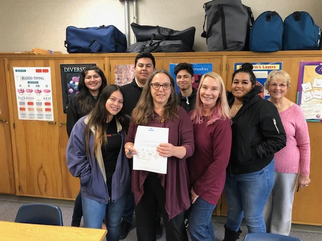 Becky Beckett, Chaparral High School Principal is joined by her Science Students as she receives her notification letter of receiving a Grant from the Ojai Education Foundation to fund Science supplies for the 2019 - 20 School Year!