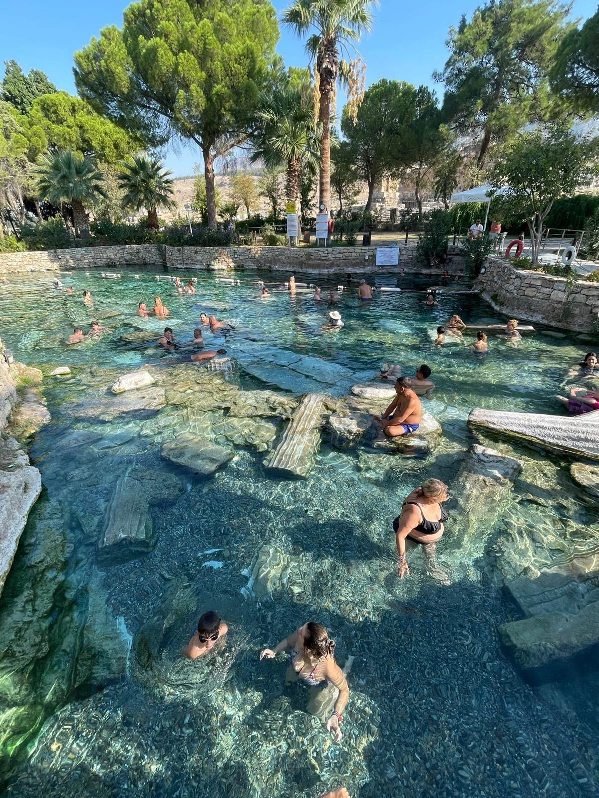 The atmospheric Sacred Pool--columns from a fallen temple are strewn across its bottom!