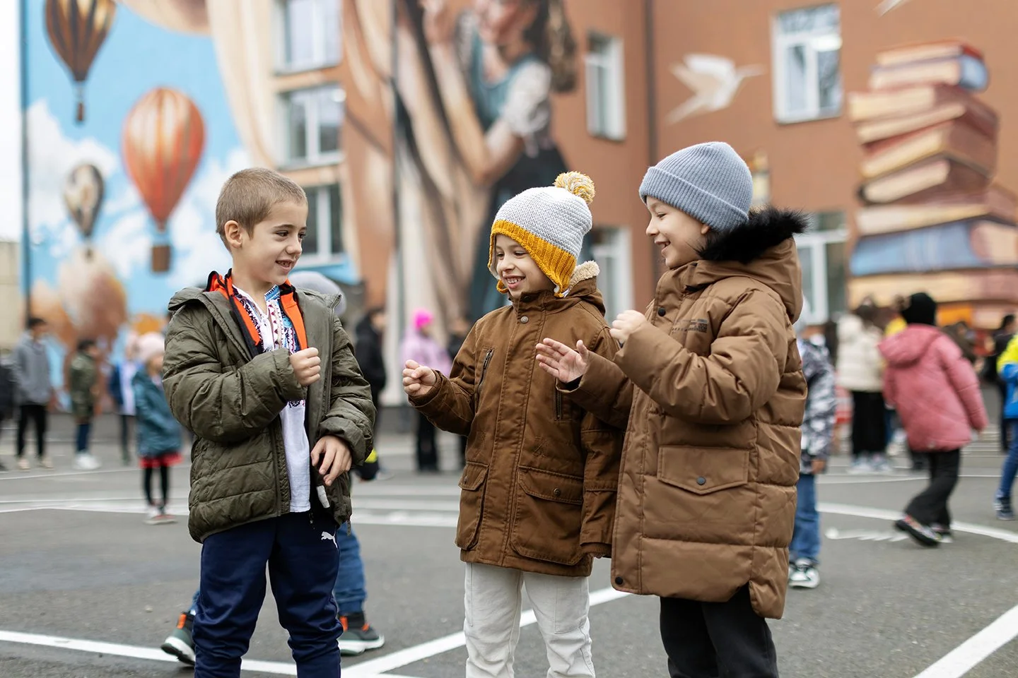 andy-bate-reportage-romania-ebrd-boys-playing-rock-paper-scissors-playground-03.jpg