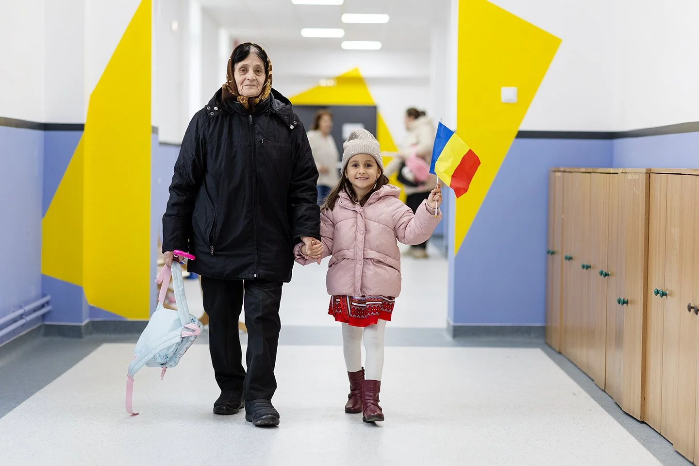 andy-bate-reportage-romania-ebrd-optimistic-child-grandmother-romanian-flag-13.jpg
