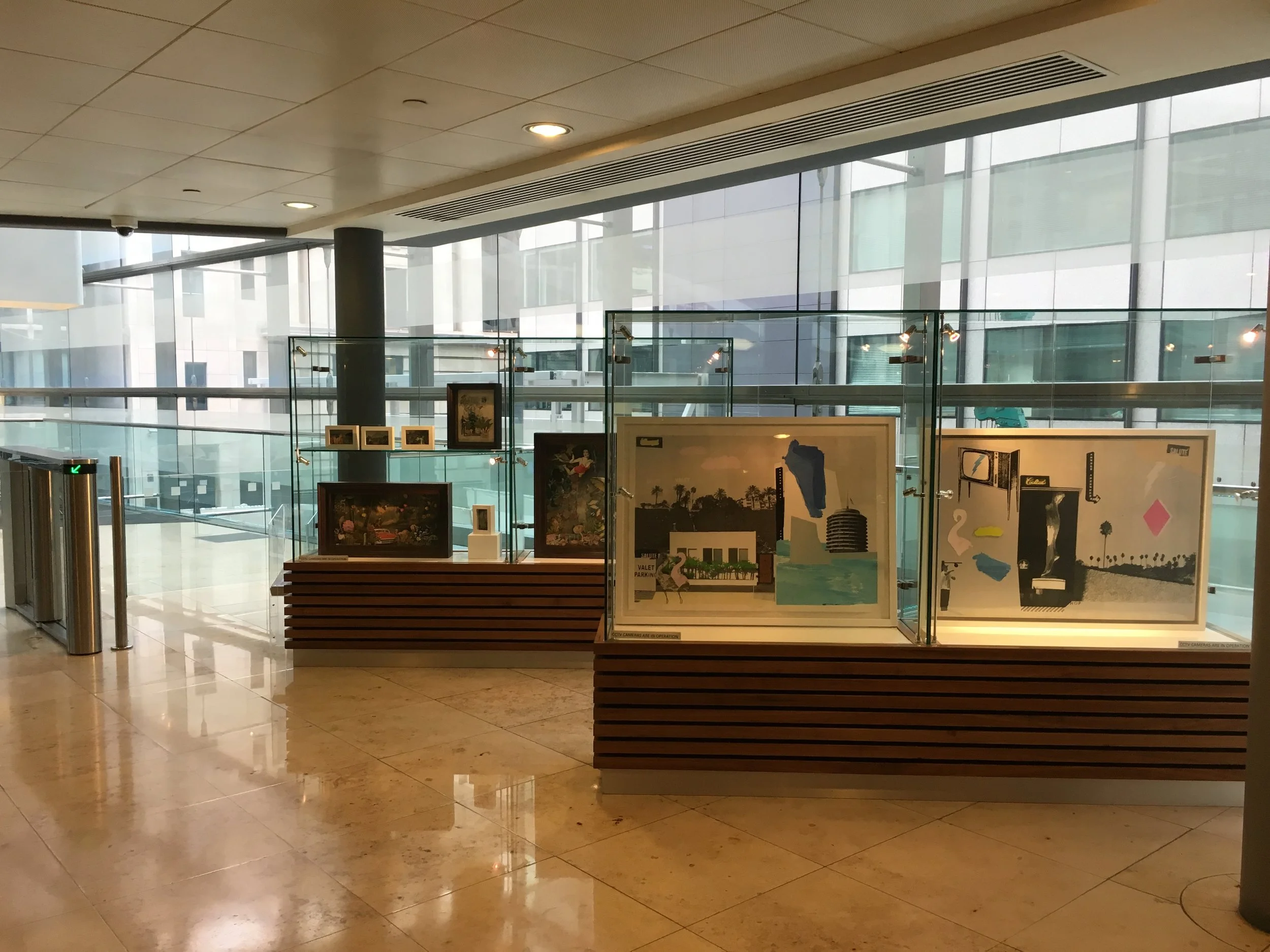 The exhibition cases at the top of the escalators