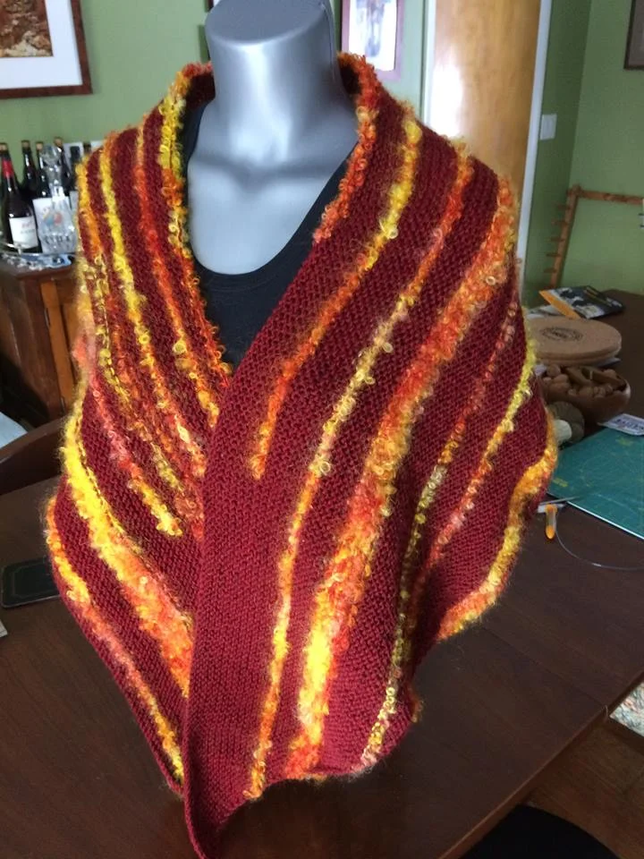 Spun the yarn splash of fire across the shoulders