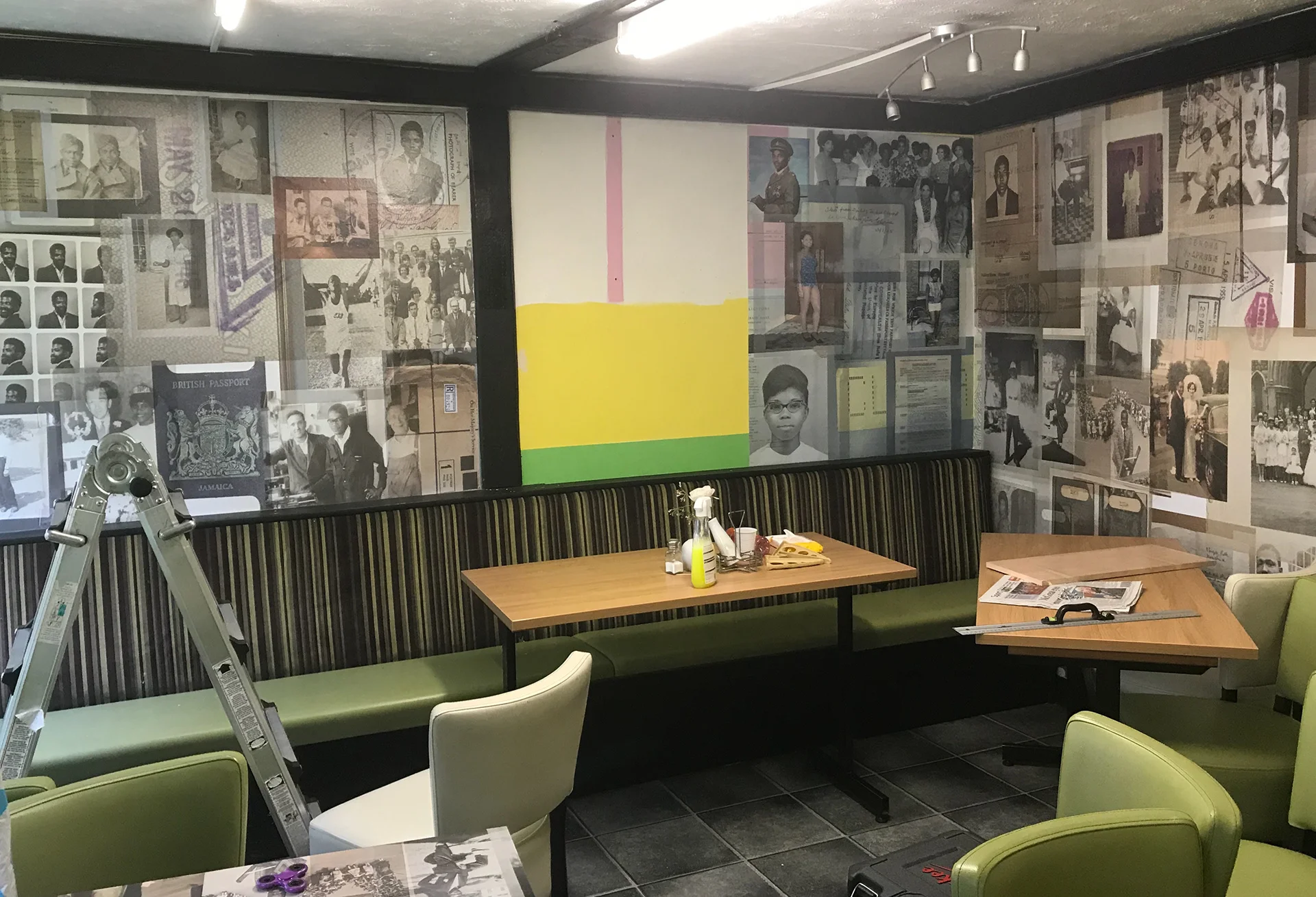 ESP installing wall decals on location at the S&S Caribbean Cafe