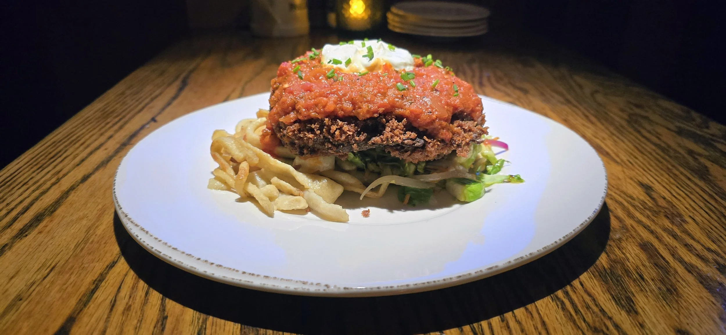 Mushroom Schnitzel on spatzle, mixed vegetables, topped with red pepper coulis and sour cream.