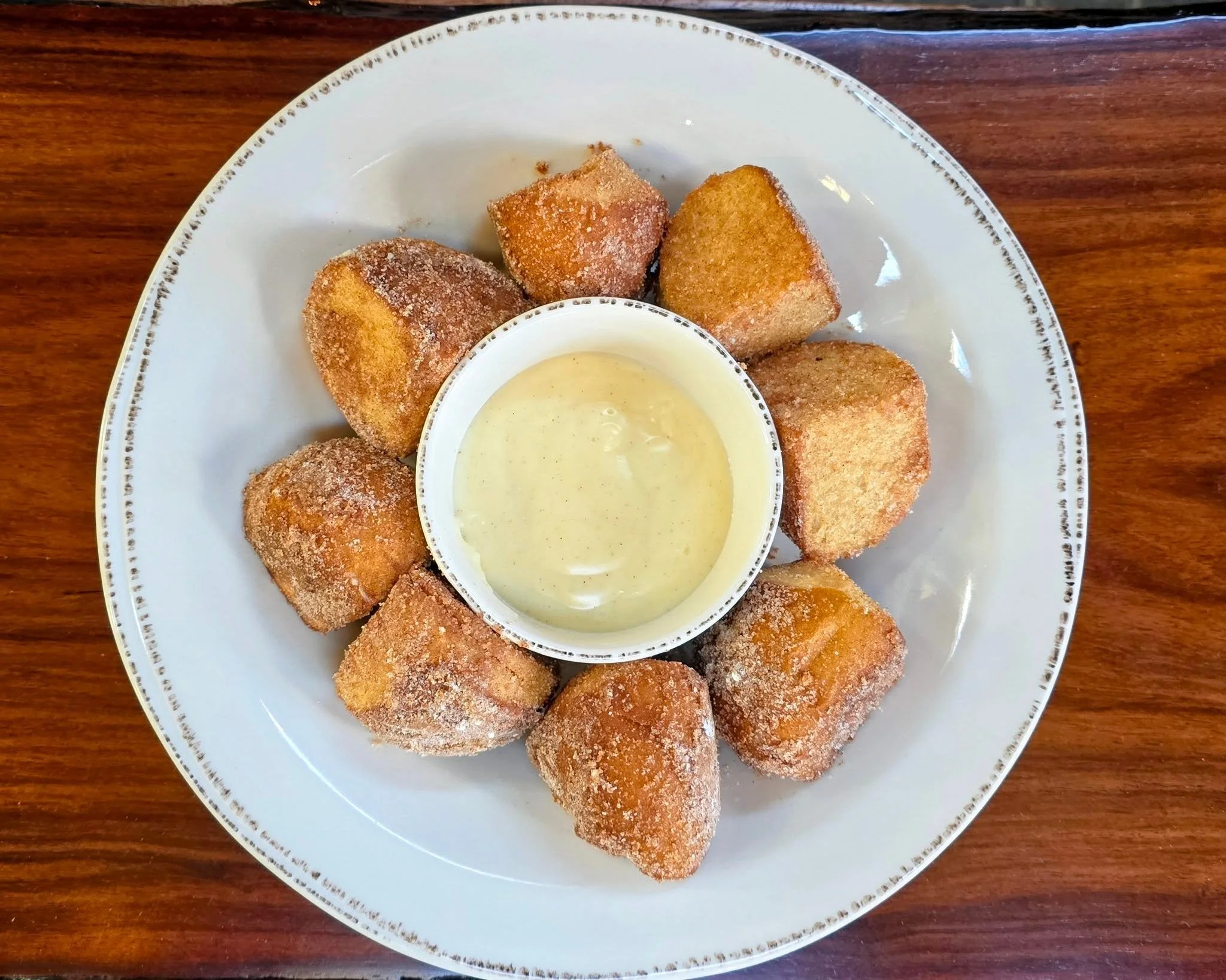 Sweet pretzel nuggets, just $5.

Soft pretzel dough, fried golden, then rolled in cinnamon sugar while it's still hot. Crisp on the outside, pillowy inside, with cream cheese icing in the middle for dipping.

It's dessert and a bar snack at the same 