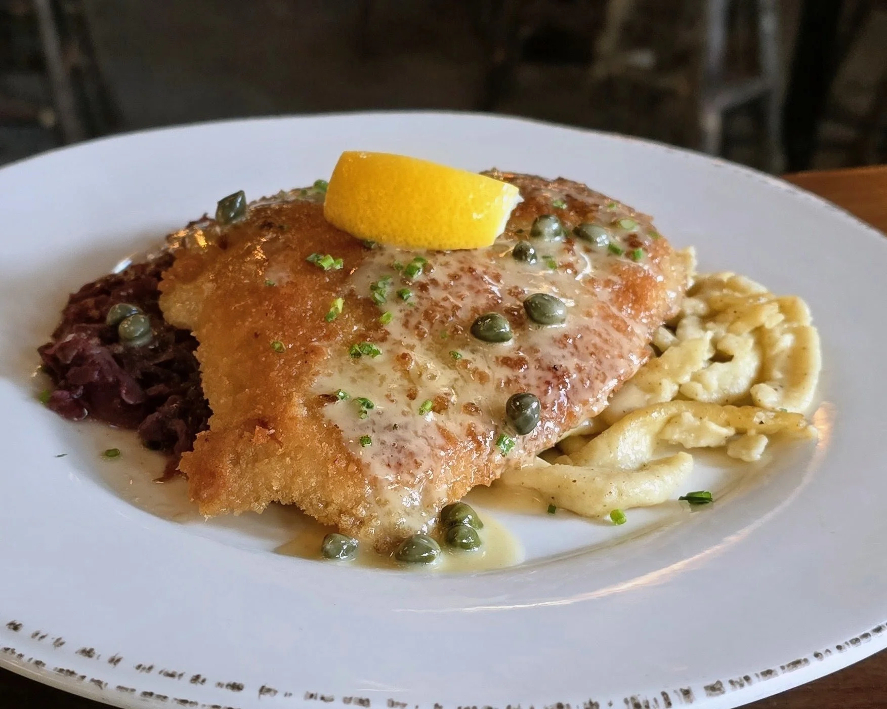 Veal Schnitzel topped with lemon butter caper sauce.