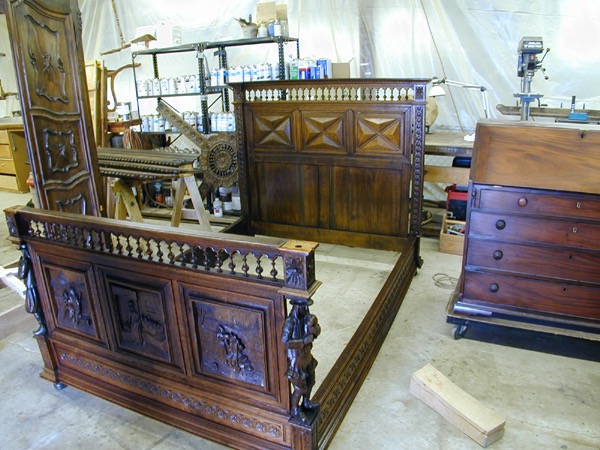 Dutch antique bed. Begun in the 17th C. completed in 18th C. Restored by Cree Studios. Also pictured, Colonial mahogany desk. 