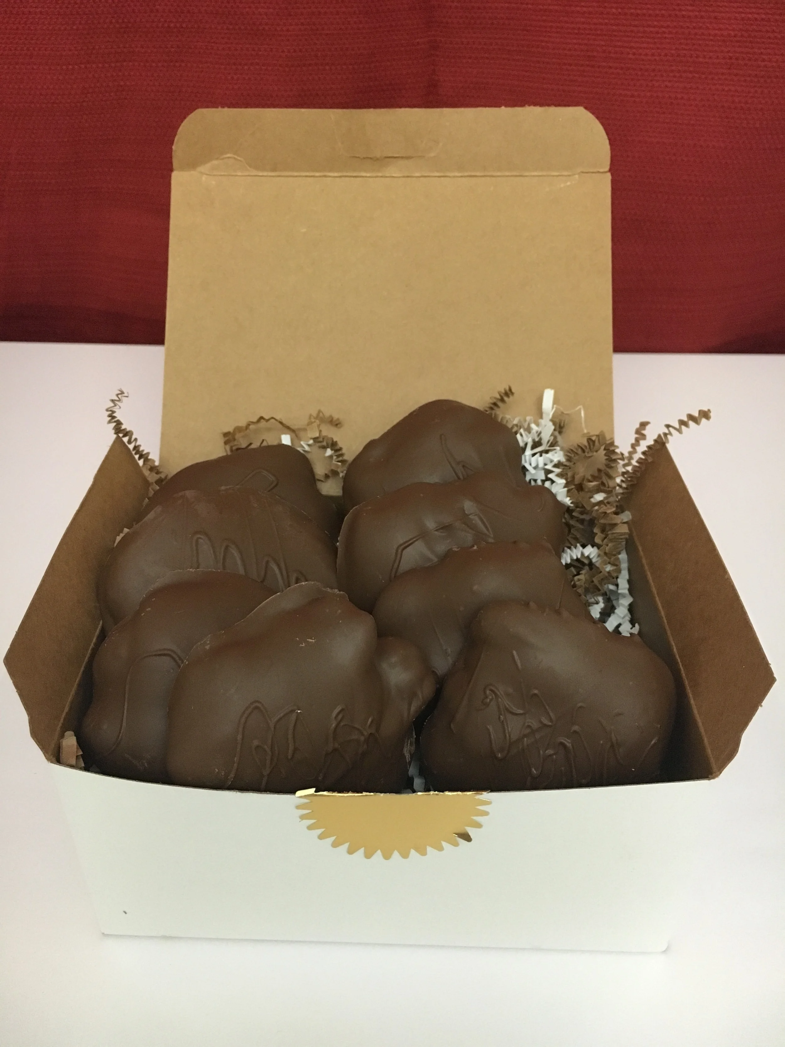Pecan + Caramel + Chocolate AKA "The Turtle". Shown here is the 1 pound containing eight of Fat Turtle Confections signature treat. $30.00