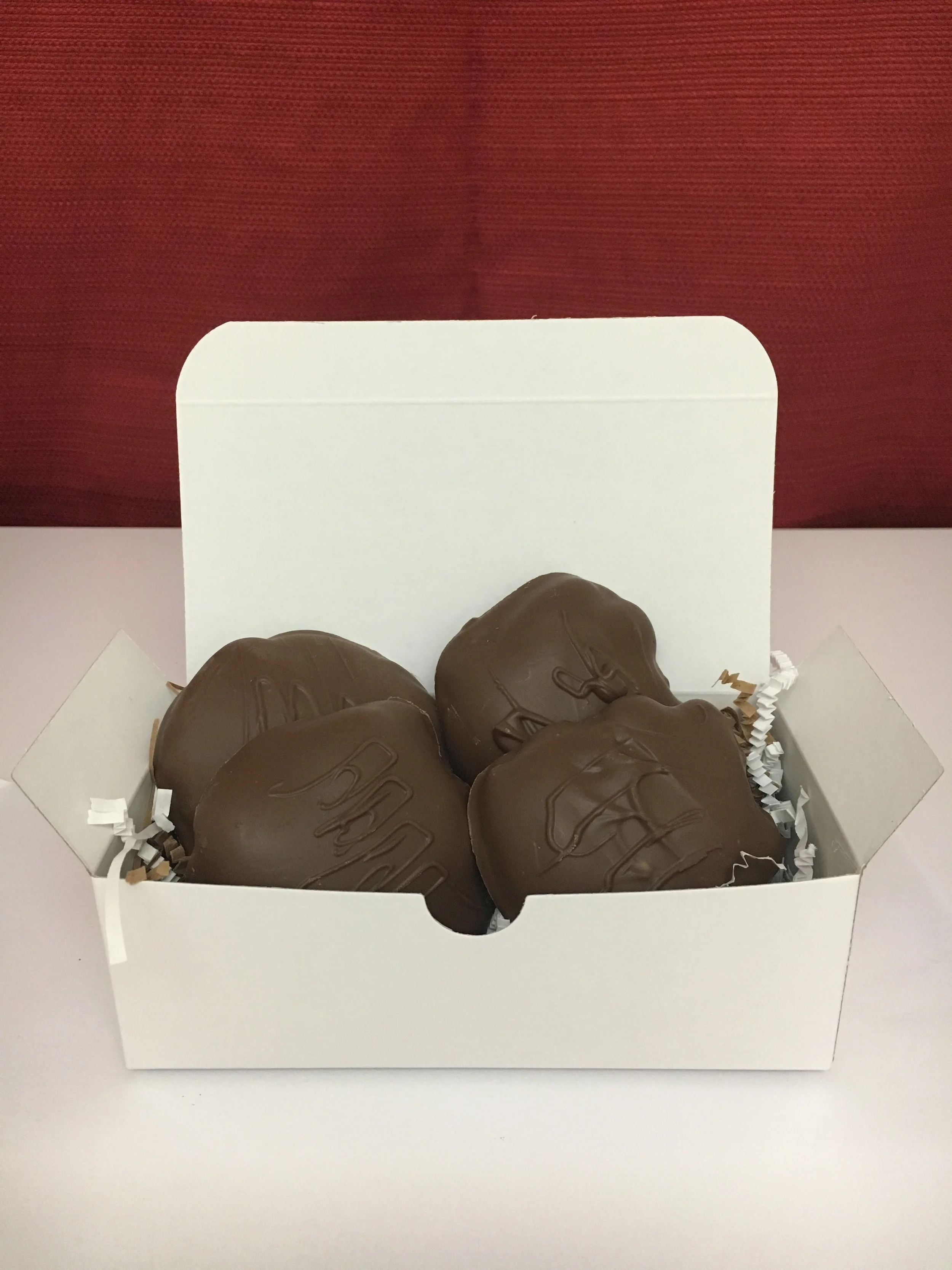Pecan + Caramel + Chocolate AKA "The Turtle". Shown here is the 1/2 pound containing four of Fat Turtle Confections signature treat. $15.00