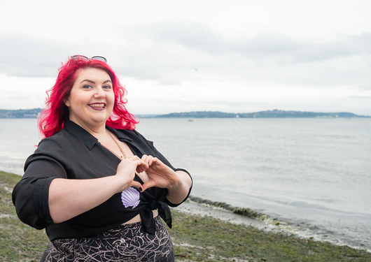 woman at ocean heart hands.jpg