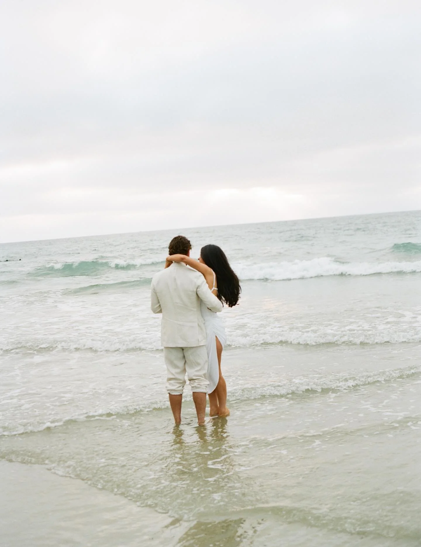 my friends Caitlin + AJ. married on the sand in a small ceremony on the beach she grew up playing at.

these kinds of intimate ceremonies will always feel so special, especially now, and especially on film.