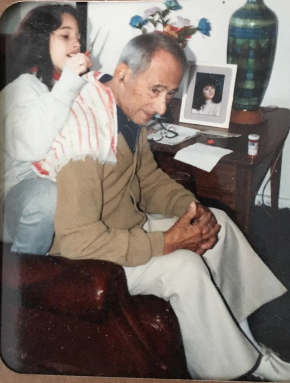 Grandpop Jack getting a haircut (I think that's my twin sister with the scissors... Not too sure.)