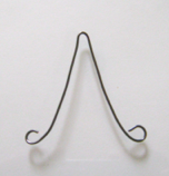step 10 - Cut a 4” piece of 18 gauge wire for the bird’s swing. Make loops in the ends with round nose pliers. The loops should be large enough to fit around the perch ends.