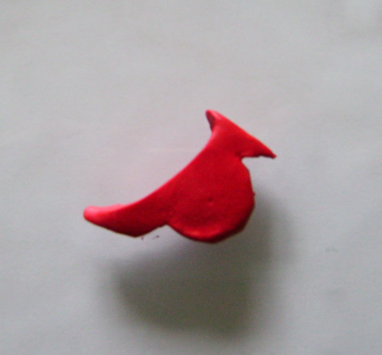 step 5 - Pinch the top of the tail with your fingers to stretch and curve it.