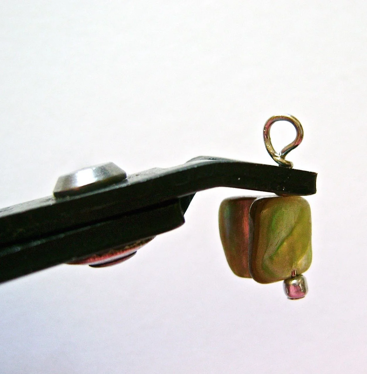 step 11 - Use a crimp tool or needle pliers to flatten the cut end of wire to the wrap.