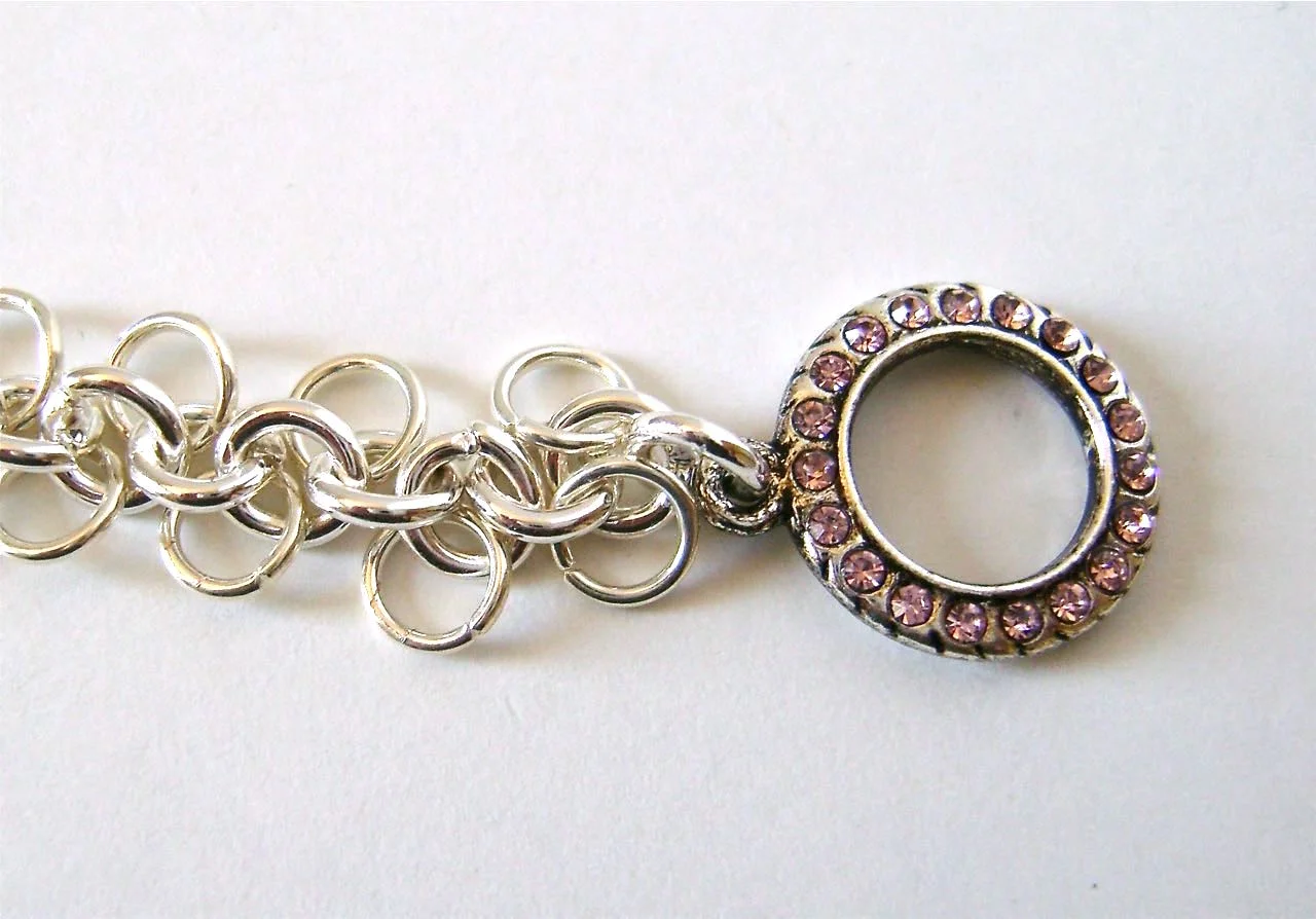 step 15 - Cut the chain to measure 6.75”. Attach each half of the clasp to the ends.