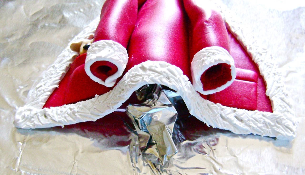 step 17 - Roll a piece of foil and place it under the center back of the coat so it doesn’t lay completely flat. Bend the sleeves slightly to add character.