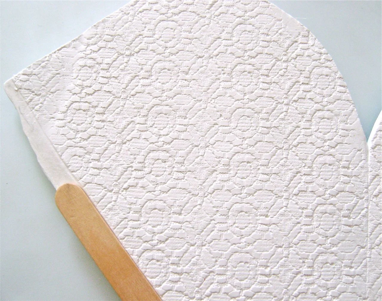 step 10 - Press a craft stick down on one back edge of the clay to create a flat 1/4" border. This will allow you to overlap the two back edges without bulk.