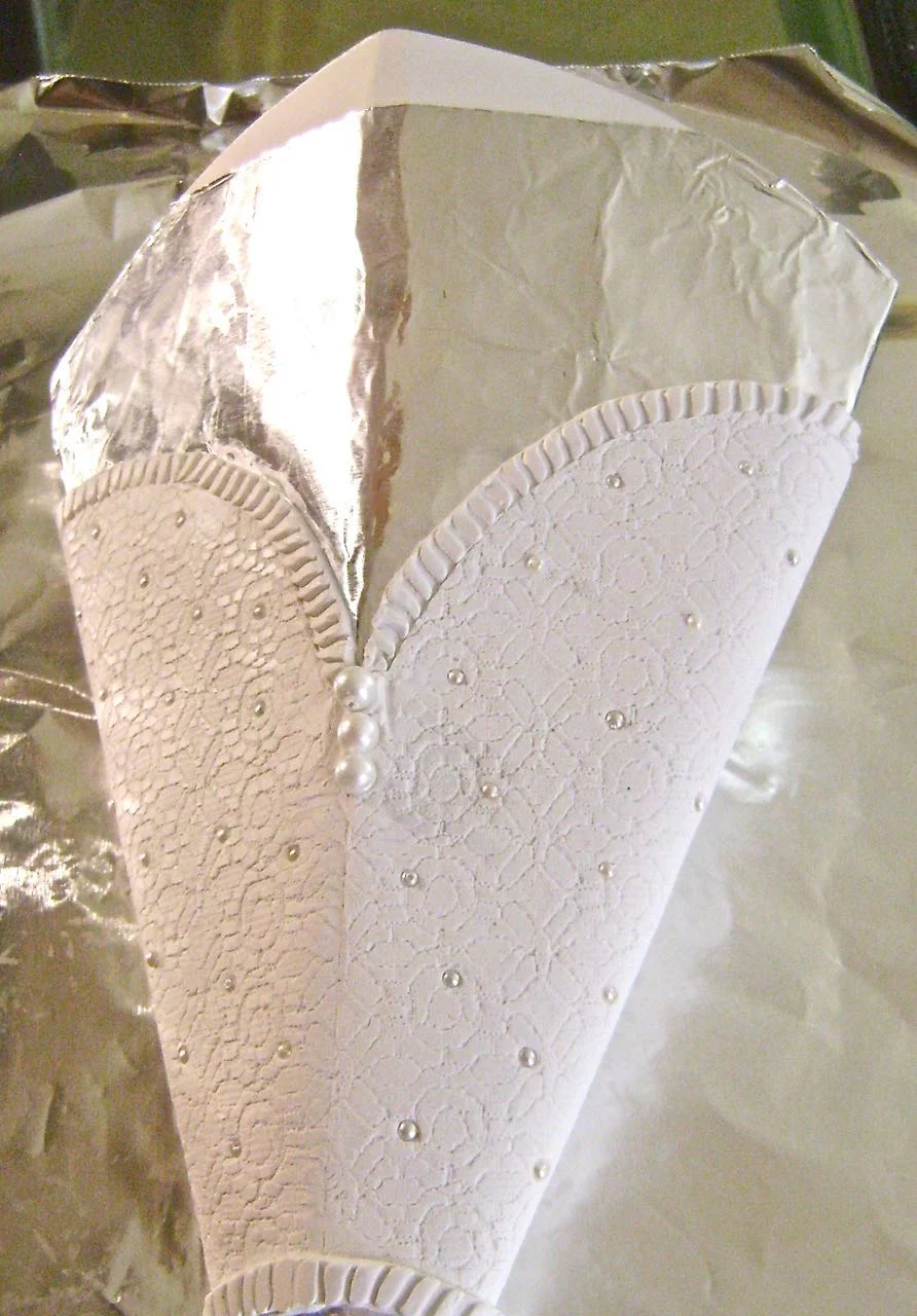 step 14 - Lift the sconce clay off the work surface peeling off the plastic backing (or wax paper). Center the clay over the foil covered mold. Overlap and blend the back seam together. Turn the work with the seam side down on a foil lined baking sheet. Bake the clay at 275 degrees for 30 minutes. Allow the clay to cool completely.