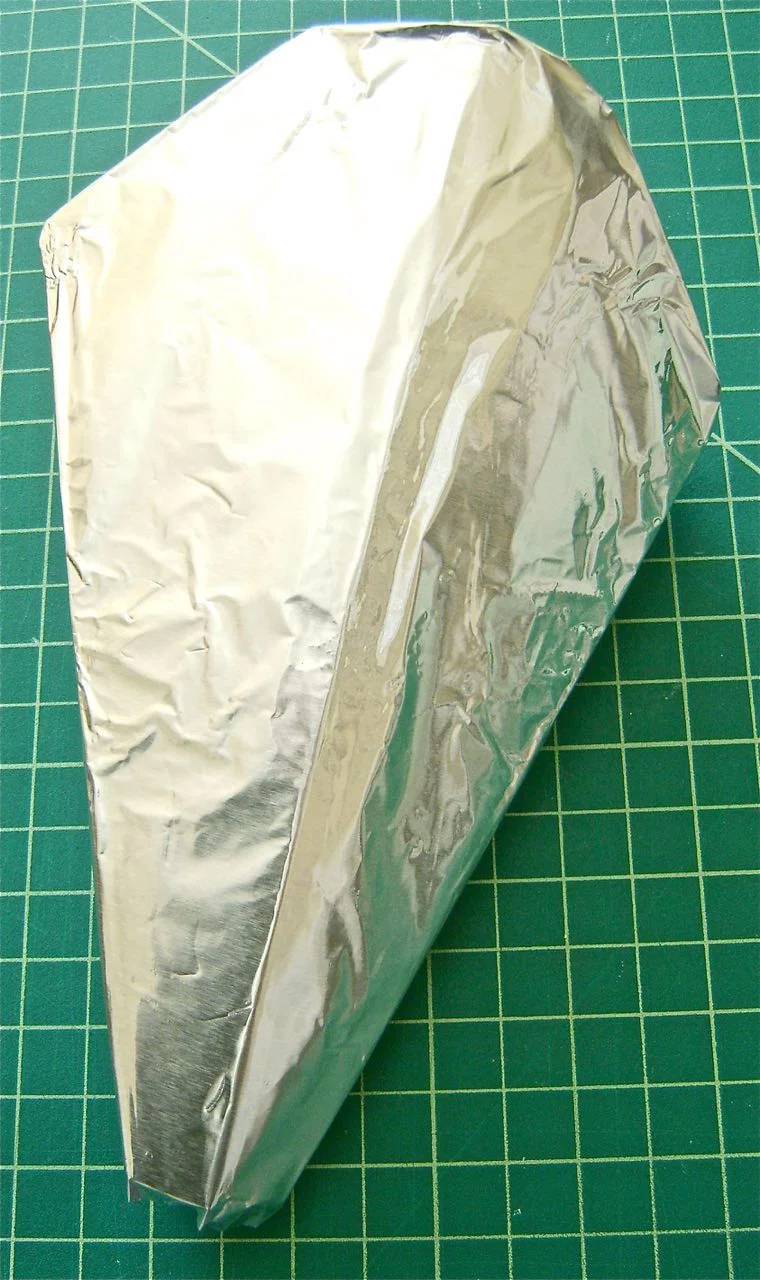 step 7 - Smooth heavy duty aluminum foil snugly over the cone, overlapping the back edges and tucking excess foil inside the top of the cone.