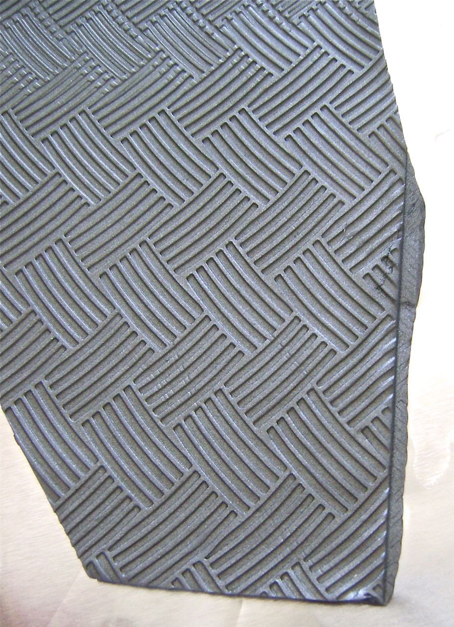 step 11 - The two sconce pieces should overlap about 1/8” in the center when joined together. To avoid too much bulk, thin out the left piece center by pressing a craft stick along the edge.