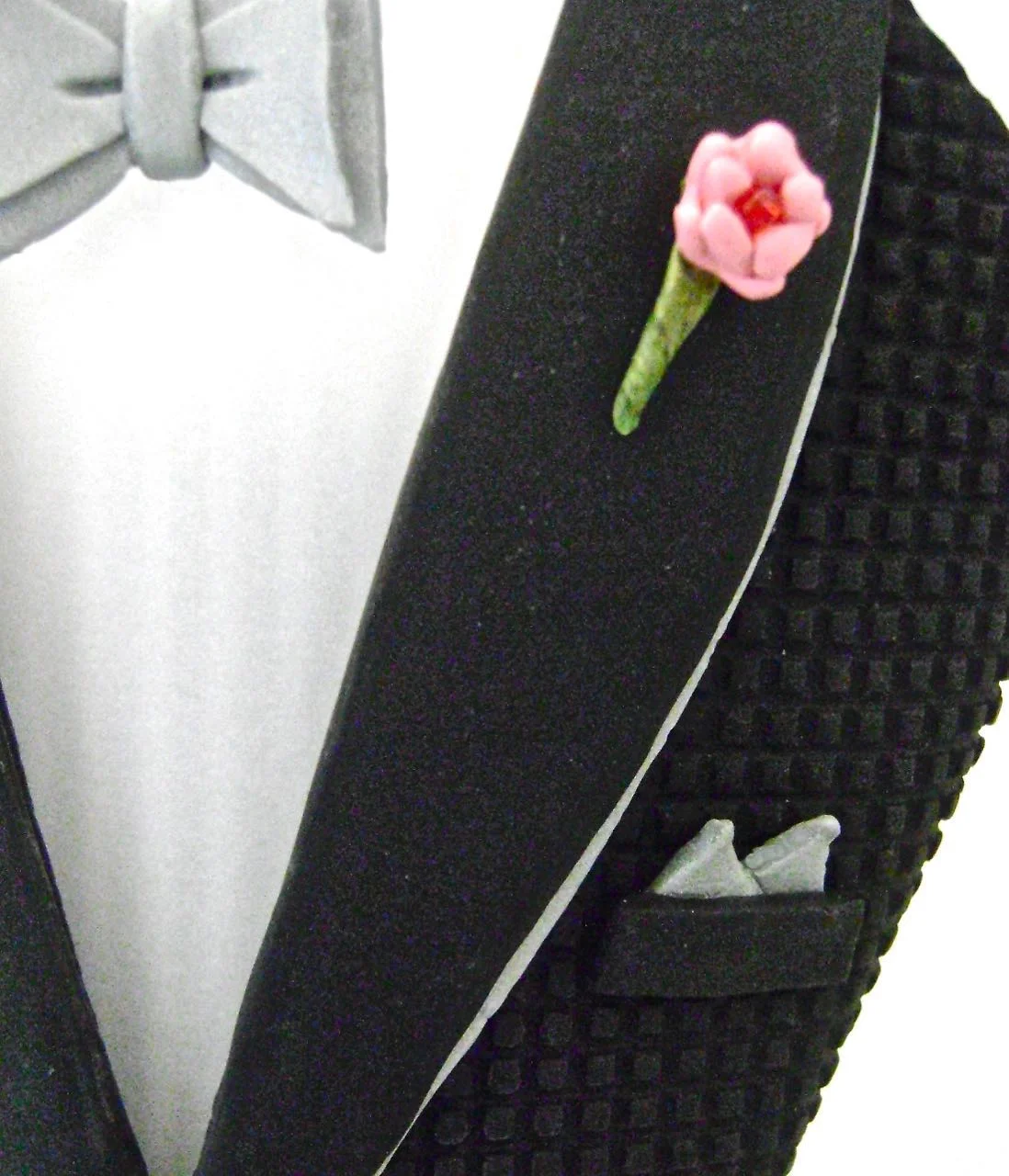 step 16 - Glue the bow tie in the center of the vellum collars with E6000. Also glue a small red bead in the center of the flower.