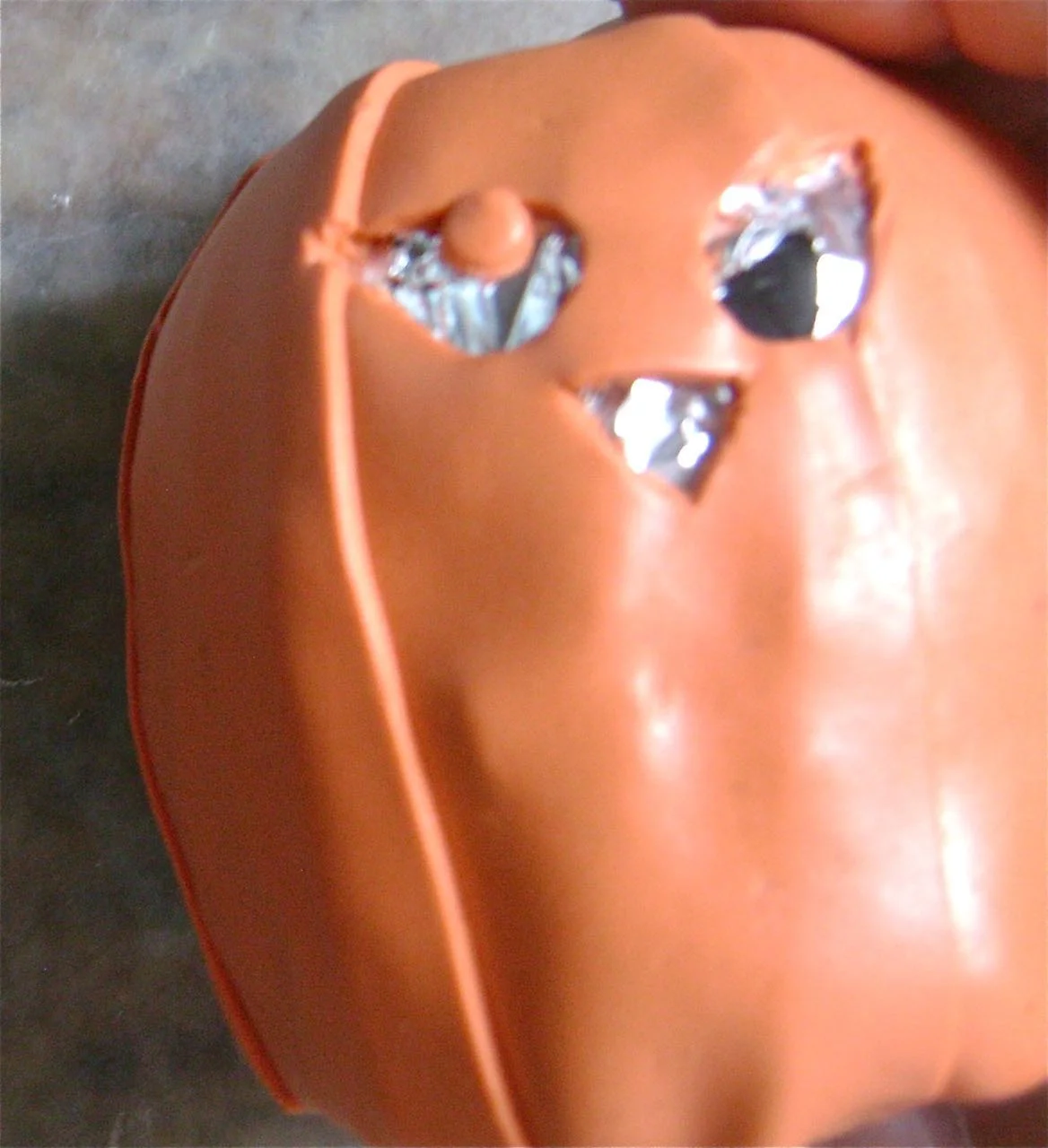 step 6 - Create a tiny round eye shape with an Etch n' Pearl tool. Blend it into the top of the eye hole.