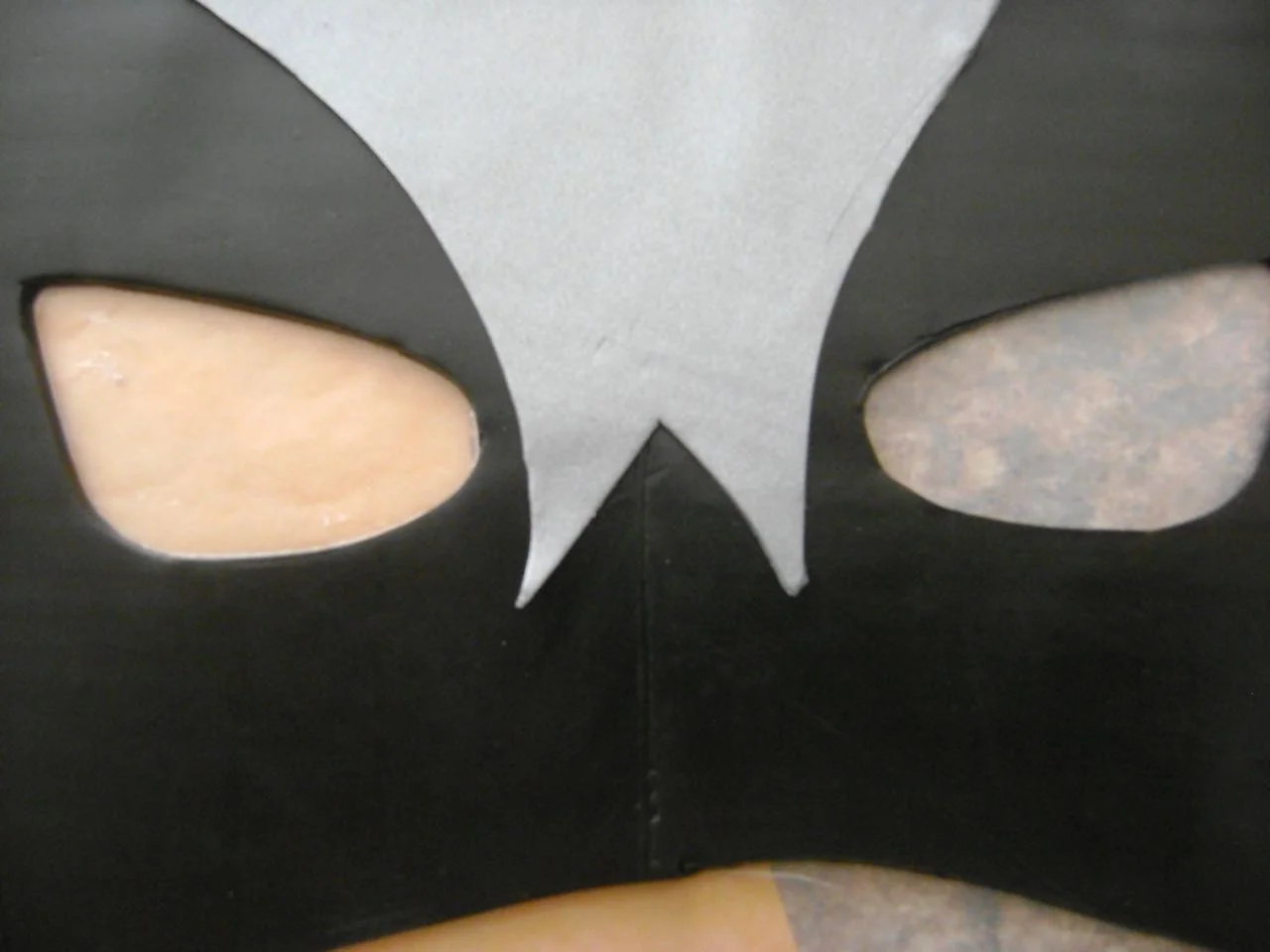 step 5 - With a craft knife and the template, cut out the silver nose accent. Place it on the clay.