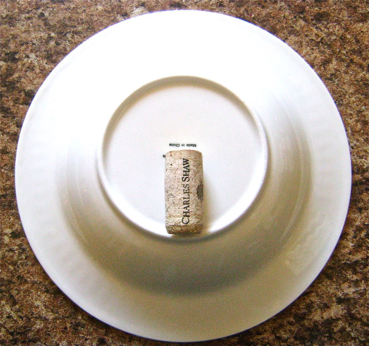 step 7 - Place a shallow 9” soup bowl on the work surface. Set a wine cork in the vertical center.