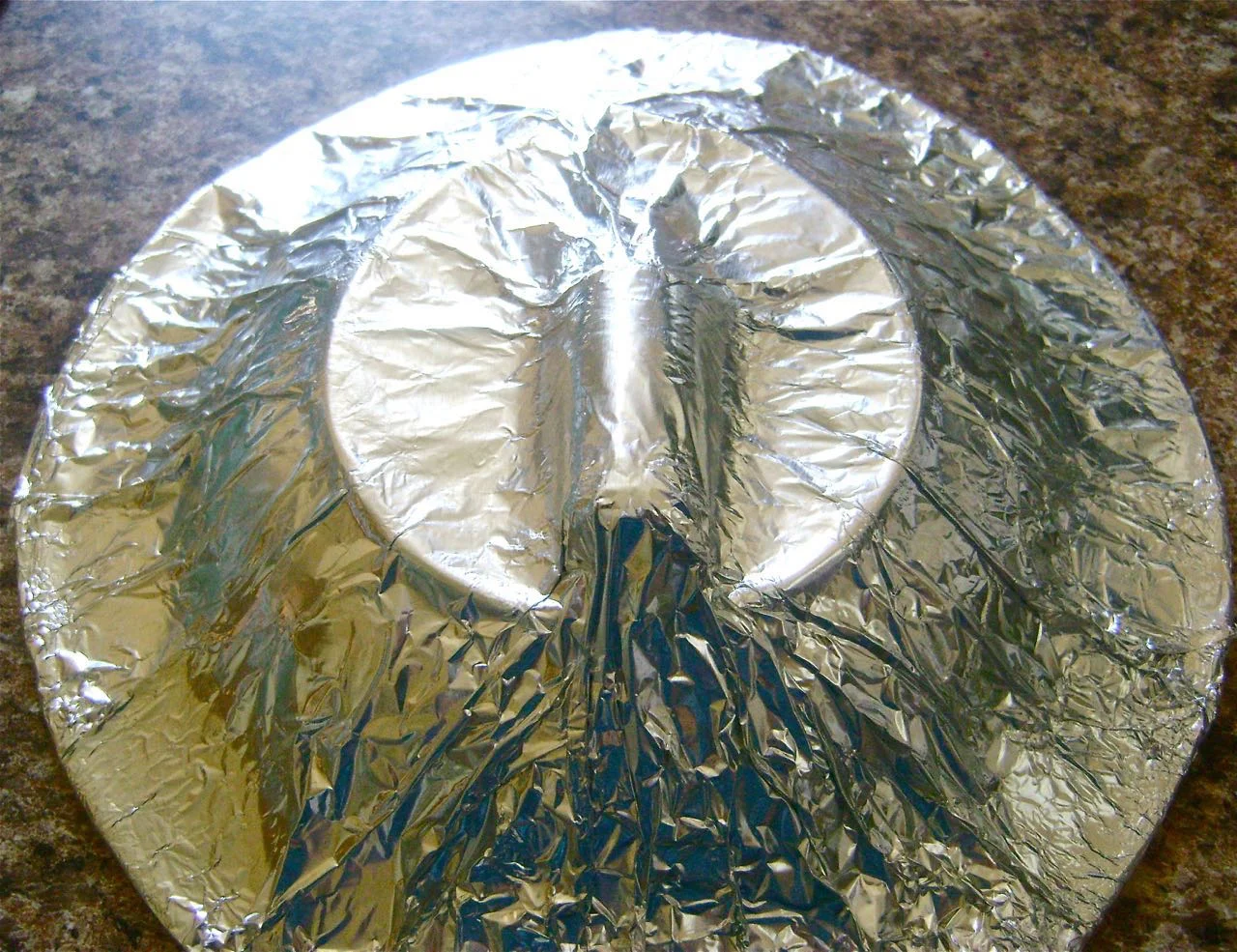 step 8 - Cover the bowl and cork with heavy duty aluminum foil, tucking in the foil around the sides of the cork.