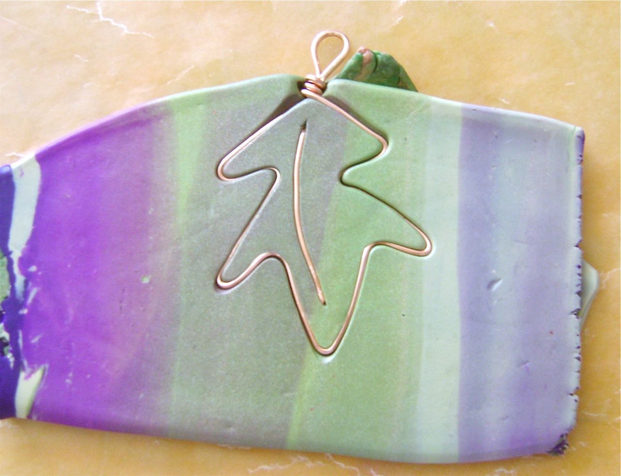 step 6 - Press the clay onto the wire shape. Flip it over.