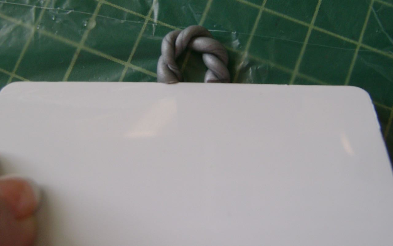 step 5 - Trim, even off and flatten the edges with an old credit card.