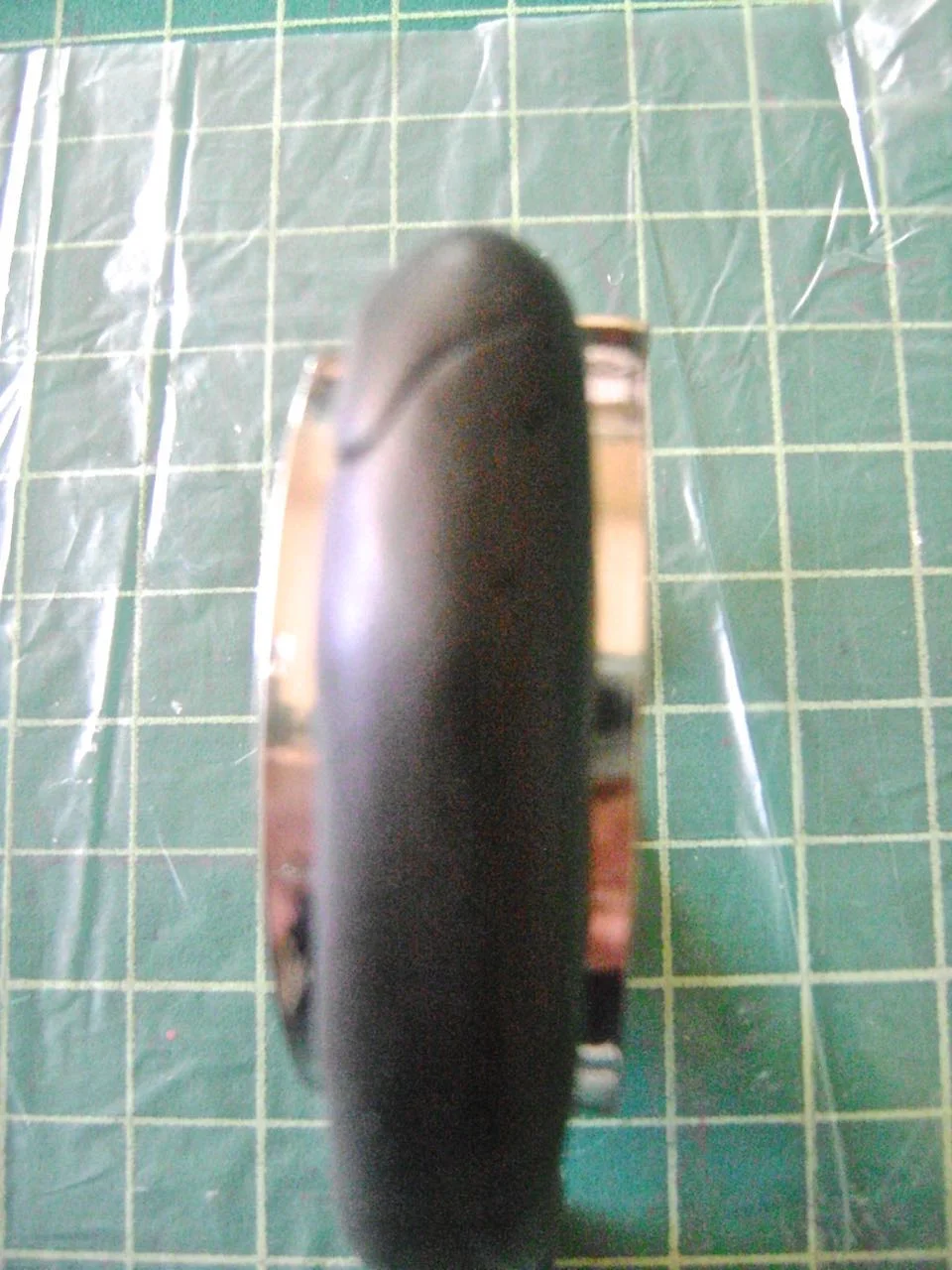 step 6 - Roll about 3/4 oz. of your base color into a tube with your hands until it reaches from one end of the bracelet form to the other and is at least 2/3 as wide as the form. Press the clay to the form. 