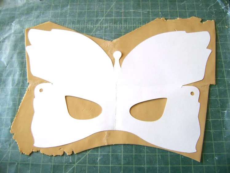 step 5 - Place the template over the clay. With a craft knife cut out the template shape. Set it aside.
