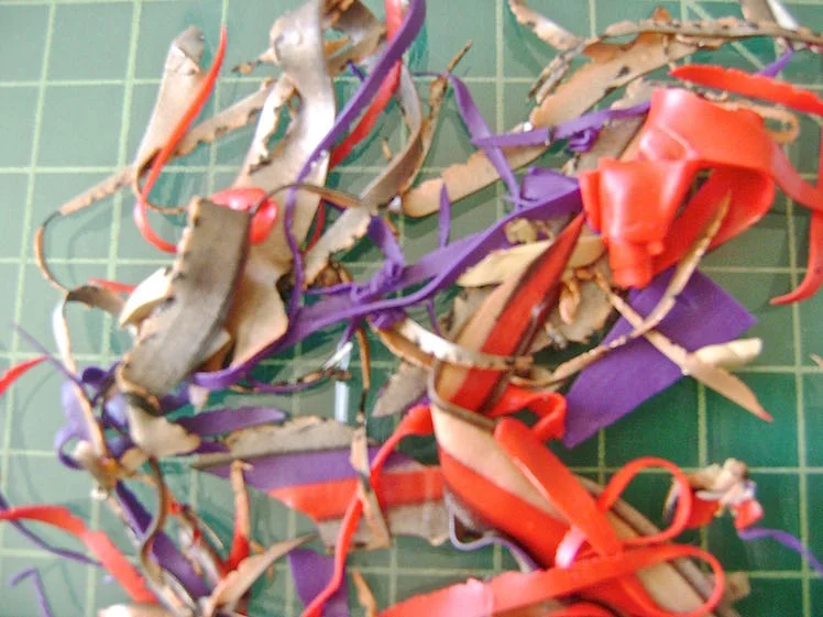 step 9 - Grab a few scraps from step #7 and roll them in your hands into a very thin tube. 