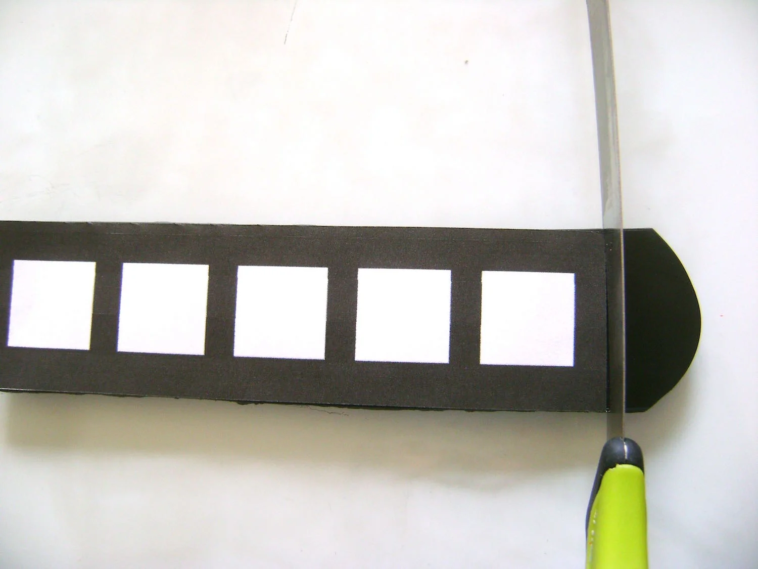 step 4 - To make the clay ring, roll out the clay on #1 setting of the clay conditioning machine. Use a blade to cut the clay to fit the width and length of the image template.