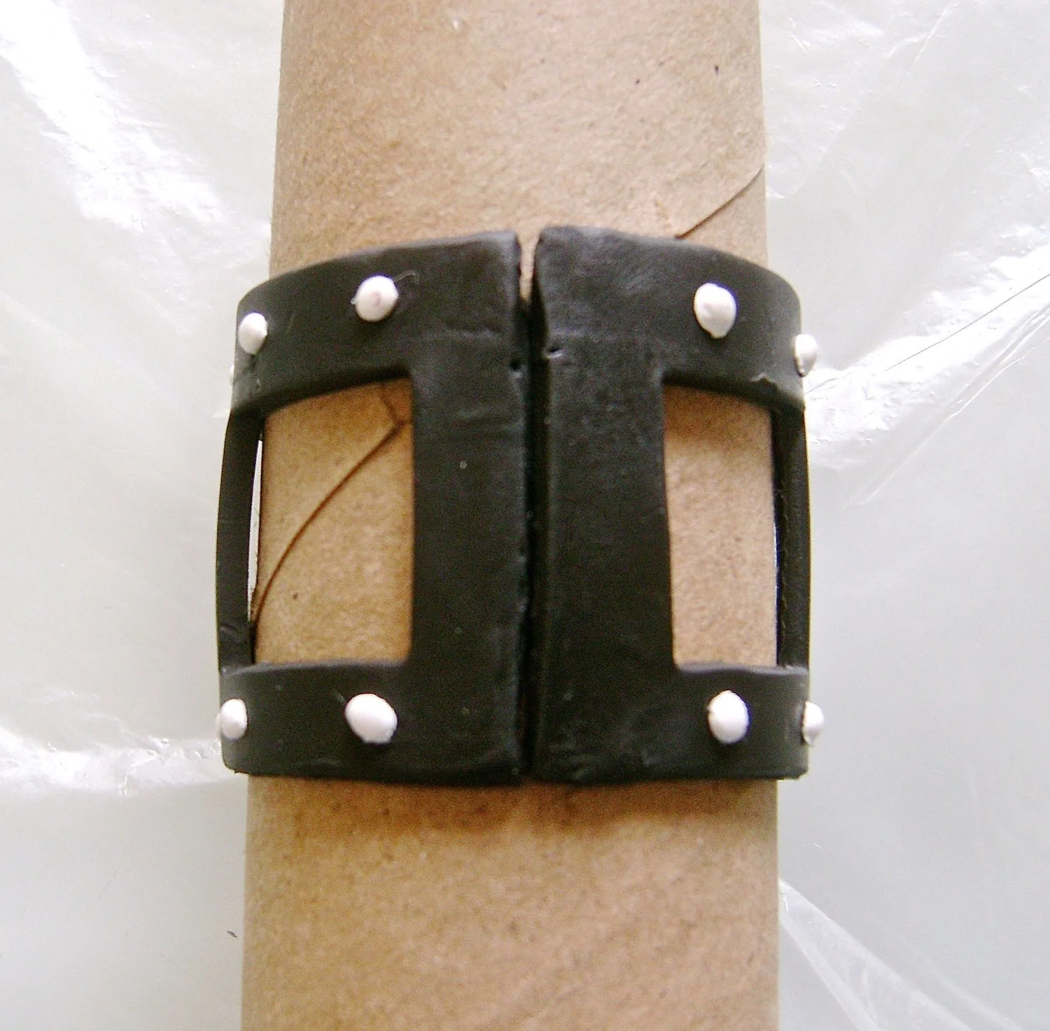 step 8 - Wrap the clay around a toilet paper roll. Don’t stretch the clay in the process. Blend the ends together using your fingers until the seam is invisible.