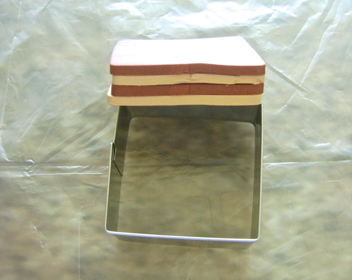 step 3 - Stack two sets (4 pieces each) of squares alternating the Bronze and Tan colors.