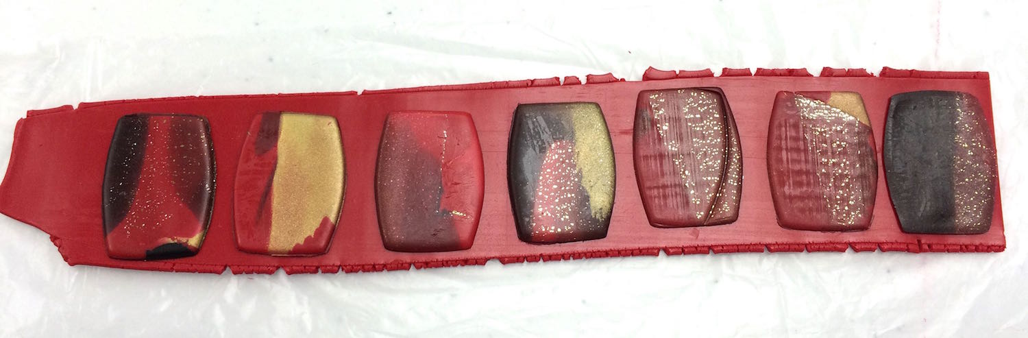step 5 - Cut out the bead shapes. Position them on the strip of Pomegranate with spaces in between each.