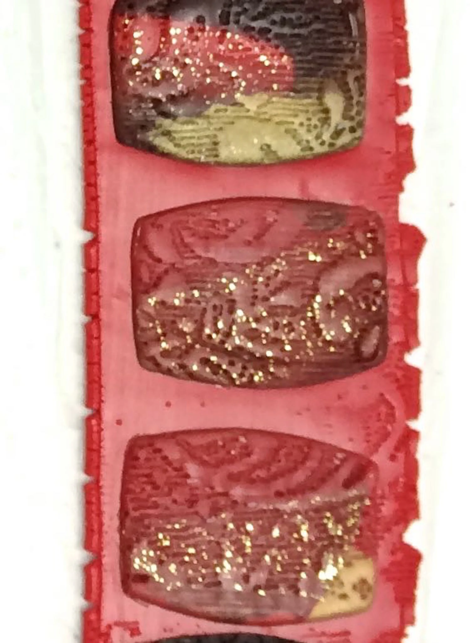 step 7 - When you press the stamp onto the clay, you’ll notice the gold leaf suddenly becomes very visible.