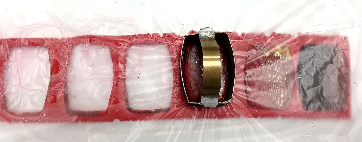step 8 - Place plastic wrap over the work and make a final cut of the beads. The plastic will create smooth curved edges.