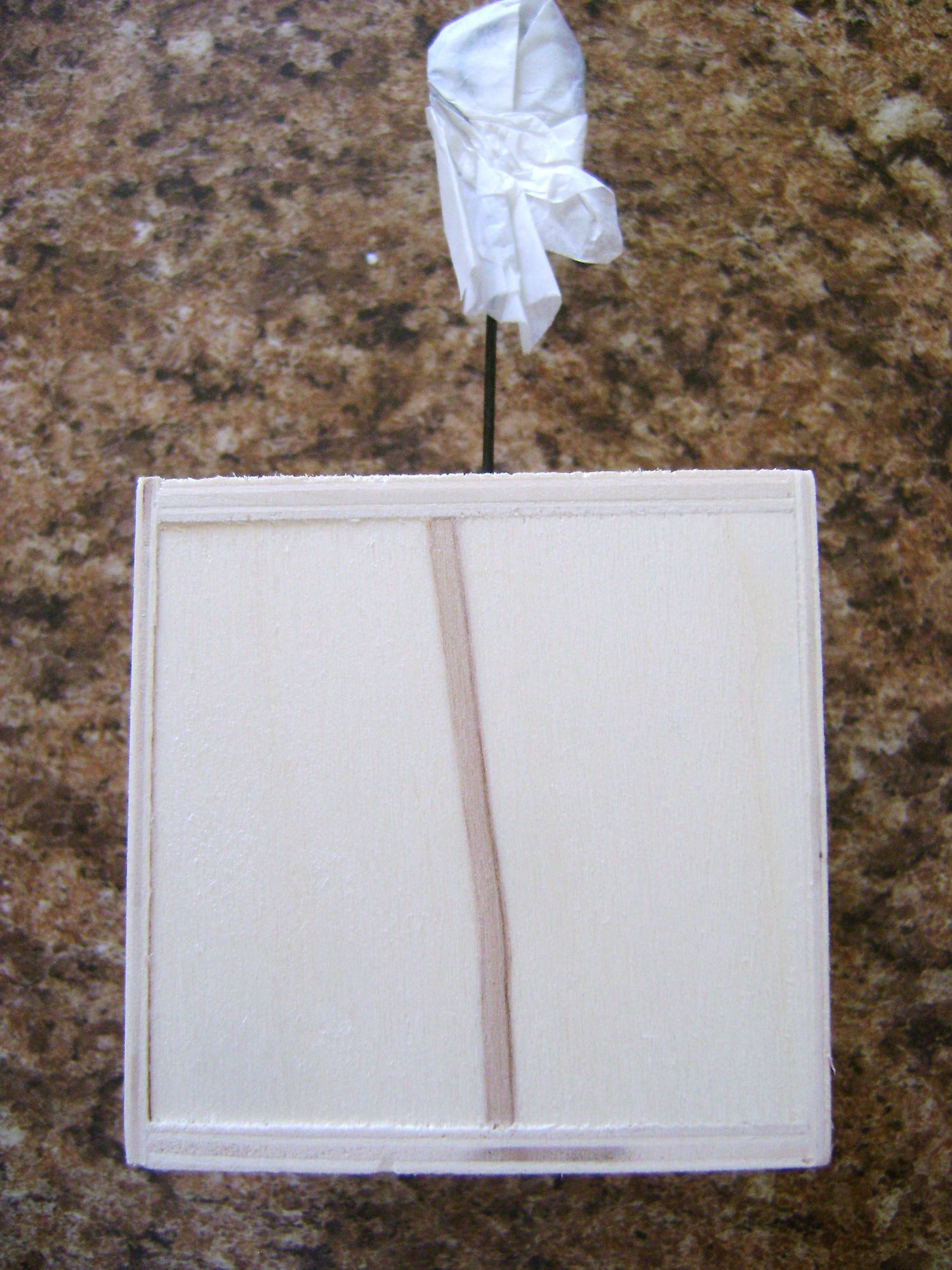 step 1 - Remove the wire from the cube. With a marker, trace the tube size onto the center top of the cube. 