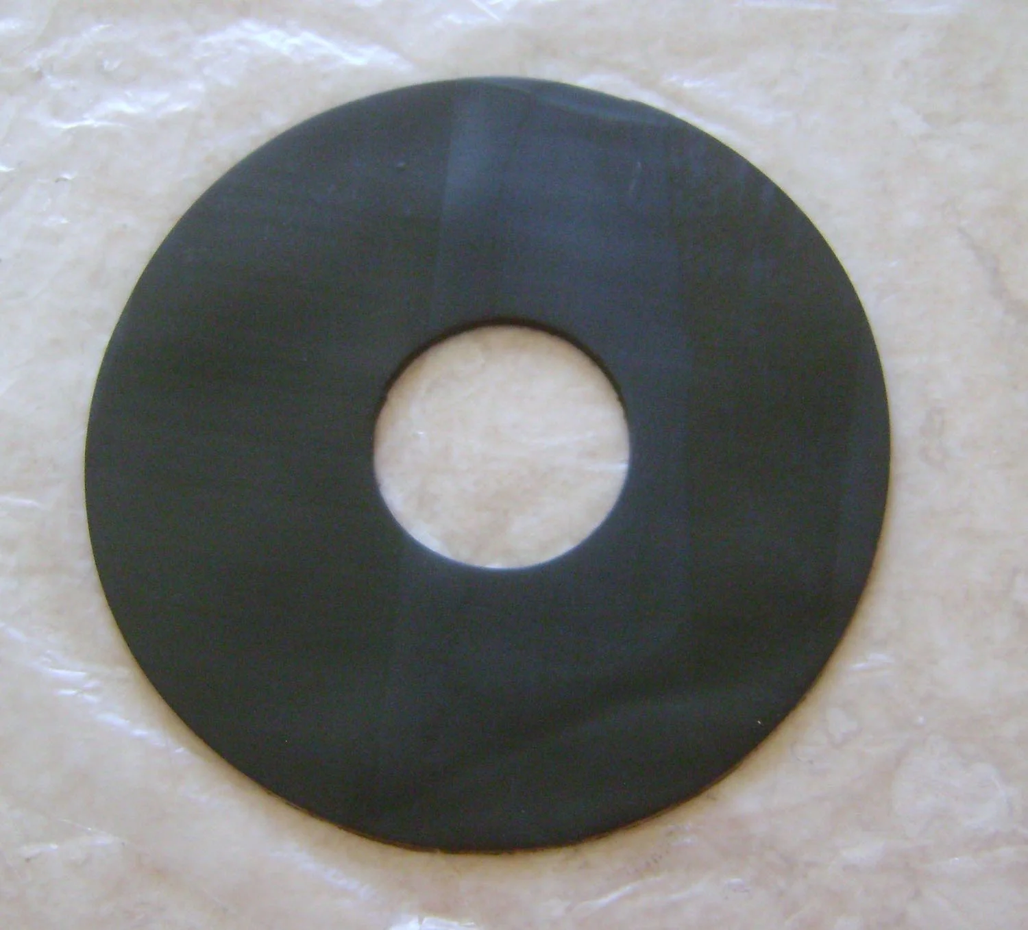 step 5 - Cut a 4” circle from clay. Cut a hole out of the center using the 1.25” cutter.