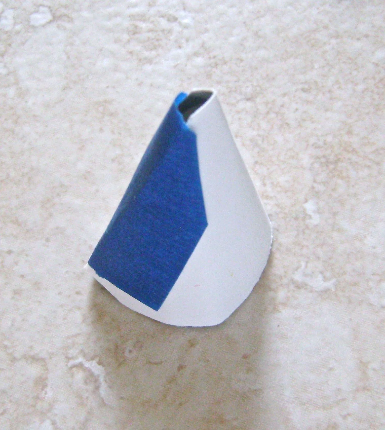 step 5 - Match up the long straight edges of the cone template and tape them together.