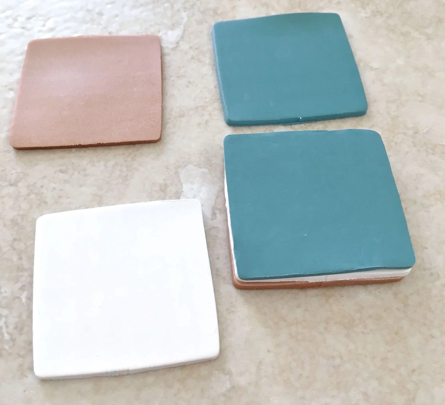 step 1 - Roll all three colors of clay on setting #1. Cut two squares from each color to measure 4”.