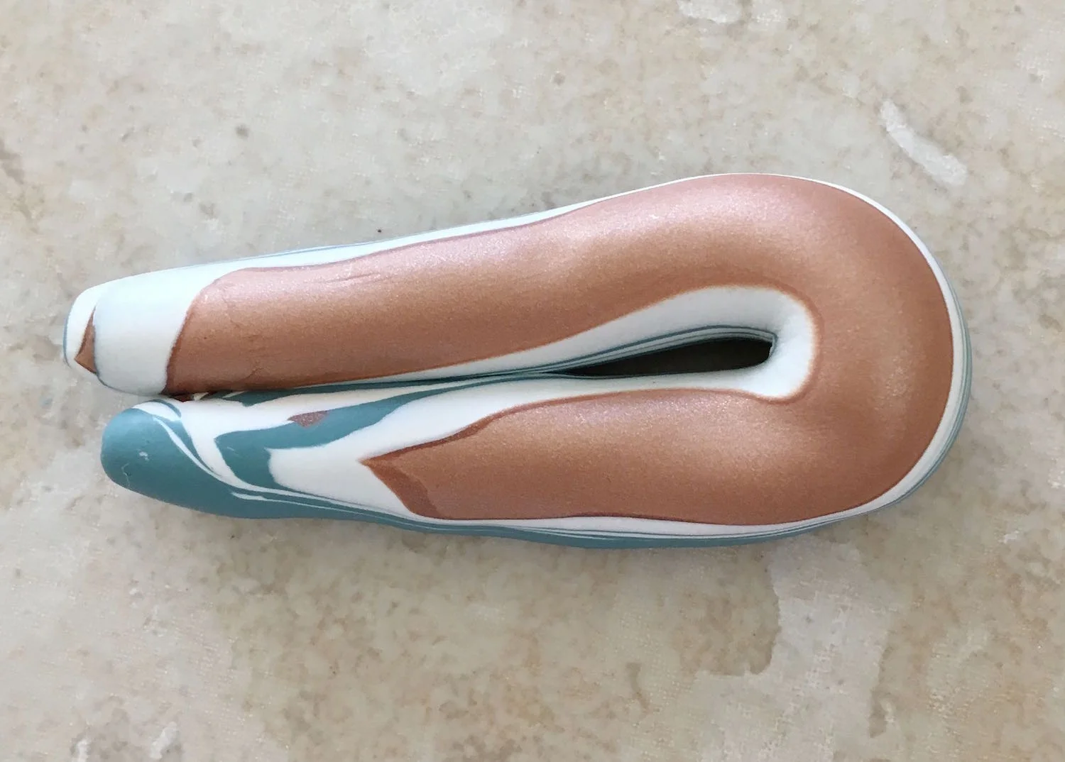 step 4 - Roll the stack into a tube with your hands. Fold it in half and roll it again.