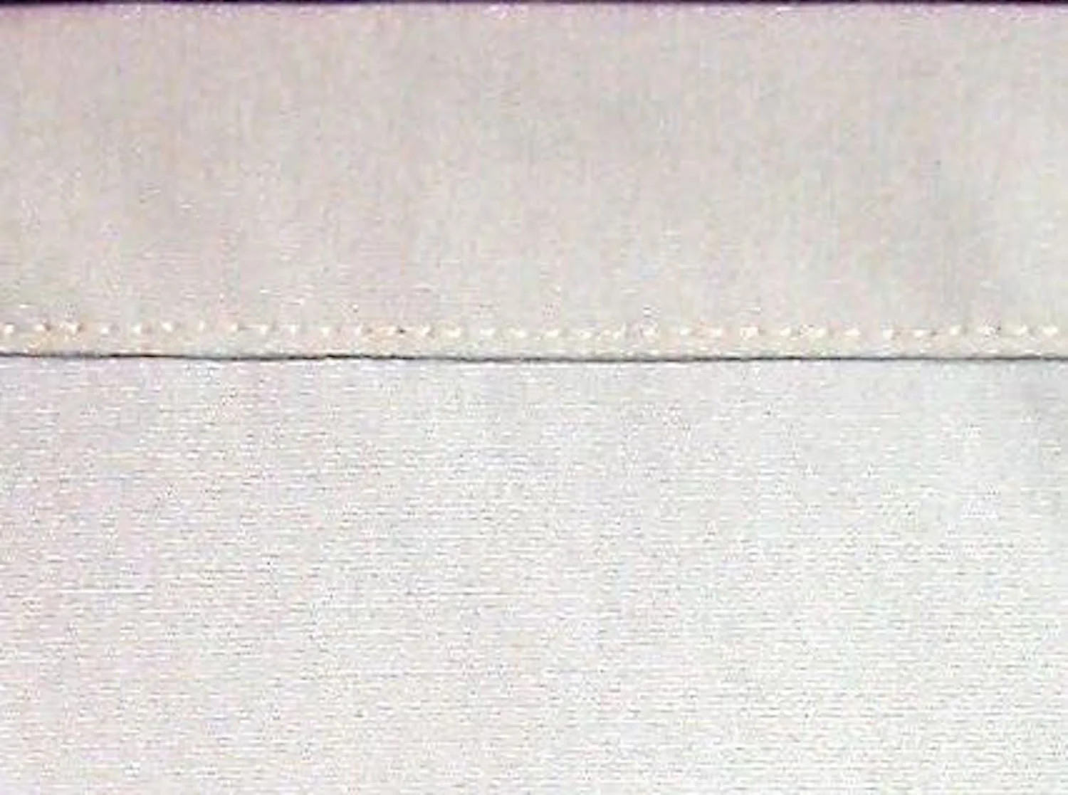 step 3 - Now do the same thing again, this time turning the folded edge down3.5” and press. This will create the pillow case border. Stitch across the 43.25” length close to the folded edge.