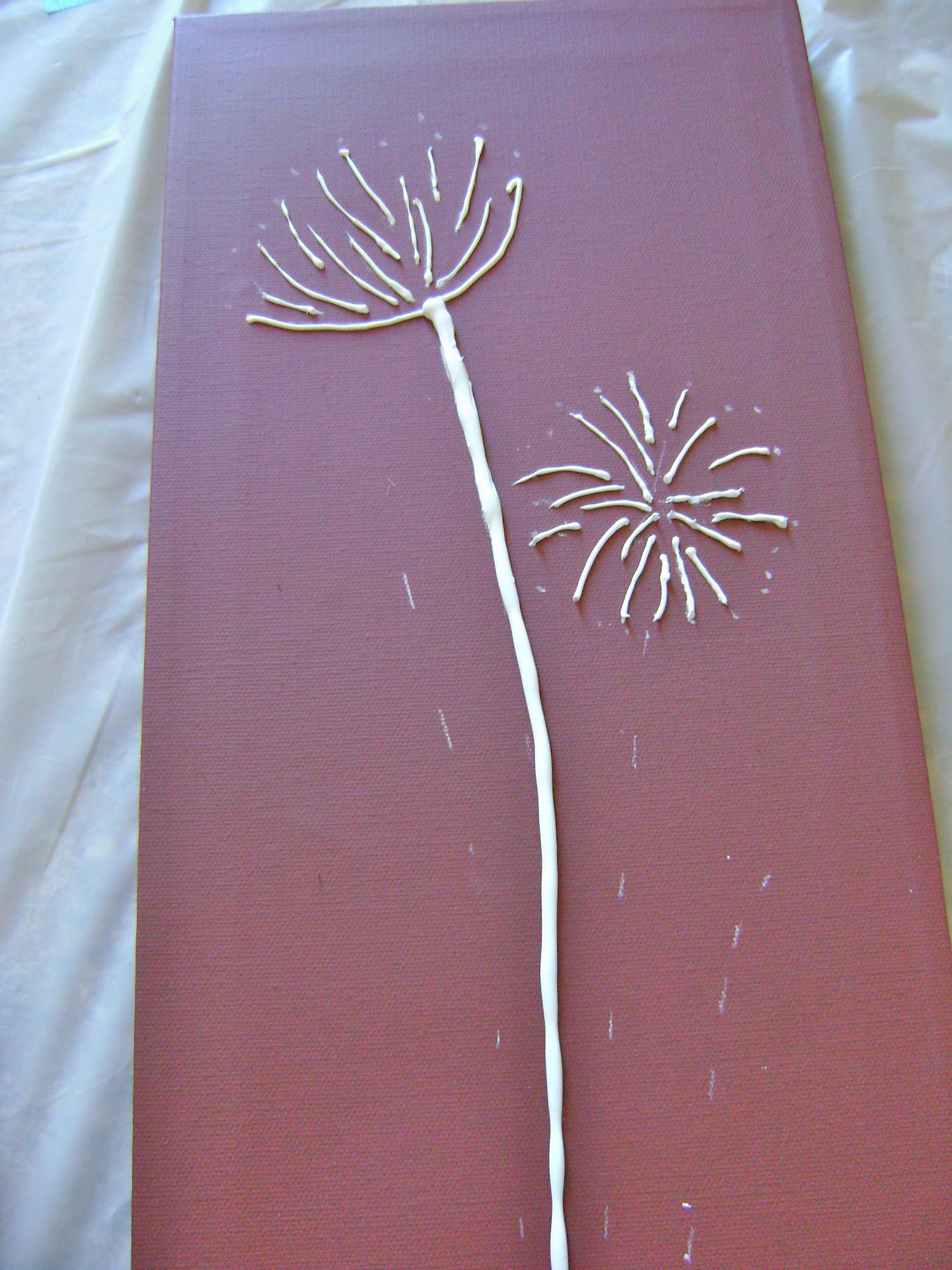 step 10 - Create the two thick flower stems with the caulking.