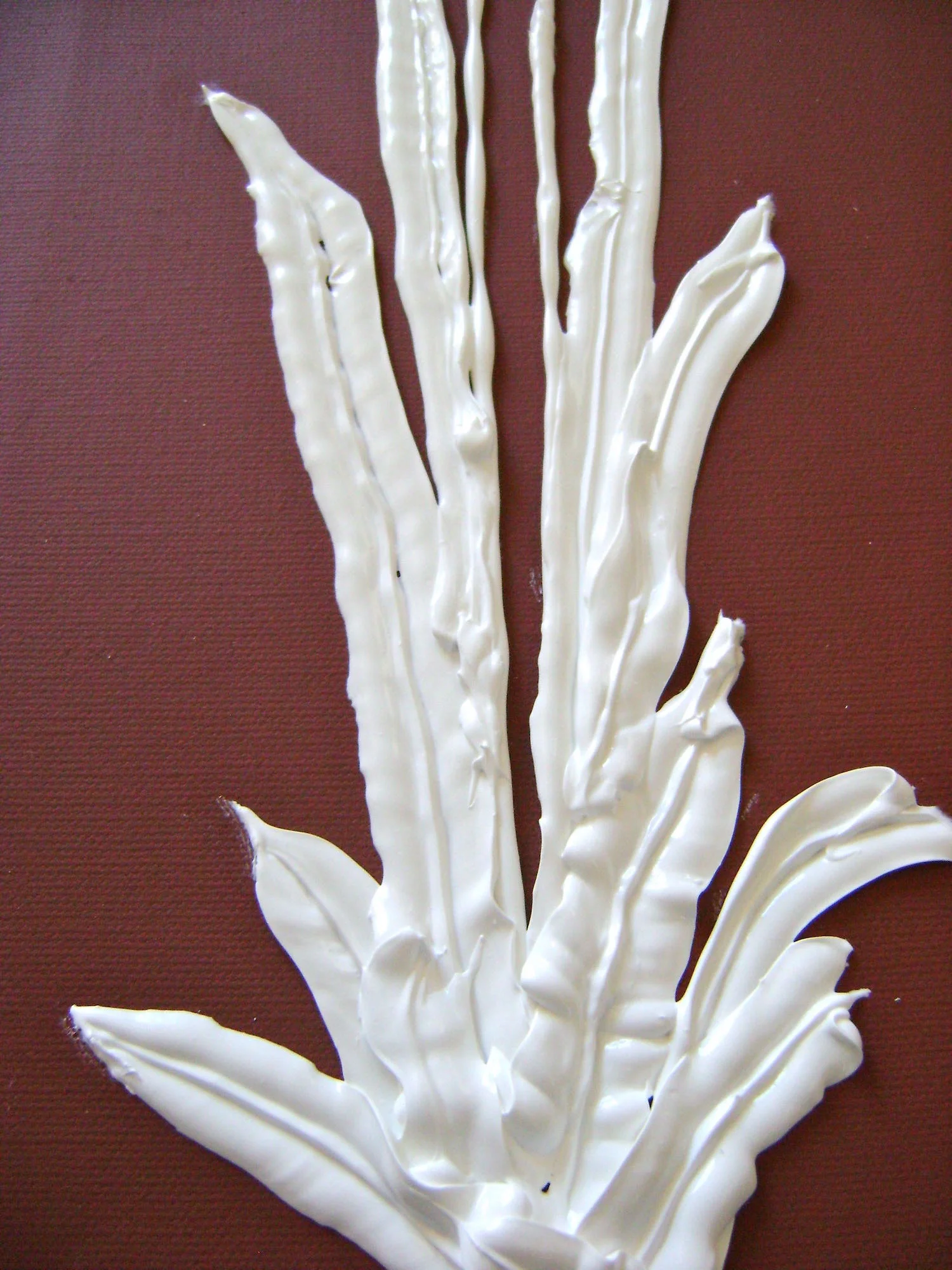 step 14 - Squeeze the bag as you follow the markings for the leaves. Don’t hesitate to overlap some. Moving steadily across the canvas will produce relatively smooth leaves. Moving very slowly will cause the leaves to lift, ripple, and create even more dimension.